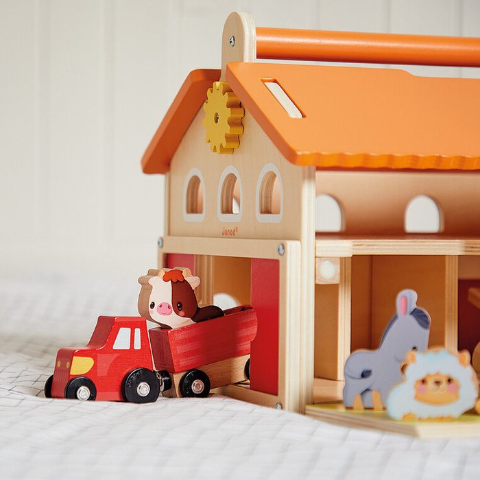 Drewniana farma z otwieranym dachem i figurkami Janod J03318 zabawki edukacyjne