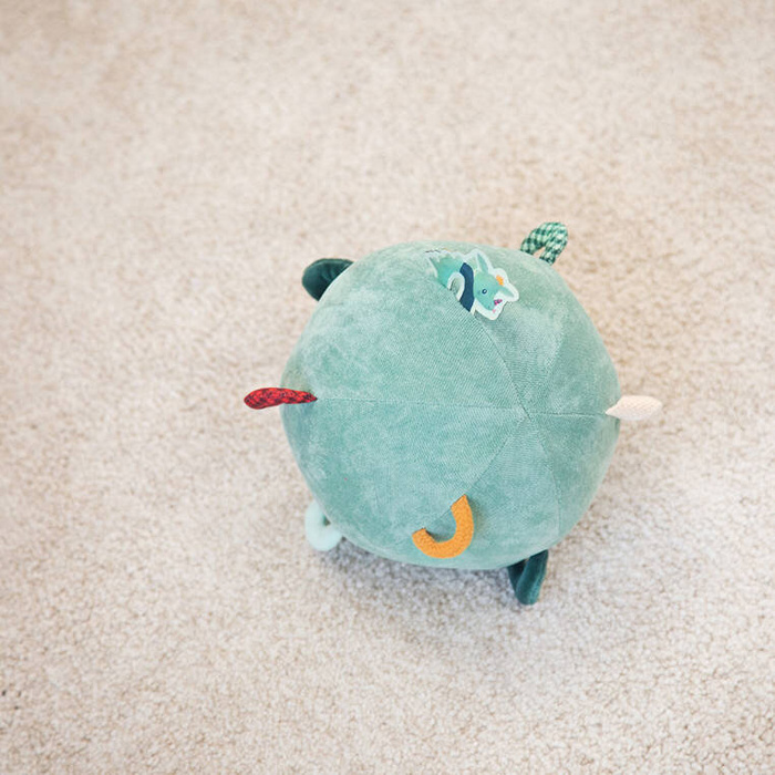 Piłka sensoryczna z pozytywką wielofunkcyjna miękka pluszowa Smok Joe 83397 Lilliputiens