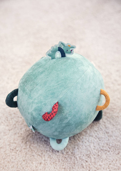 Piłka sensoryczna z pozytywką wielofunkcyjna miękka pluszowa Smok Joe 83397 Lilliputiens